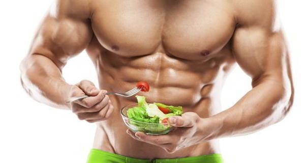 shredded man eating salad