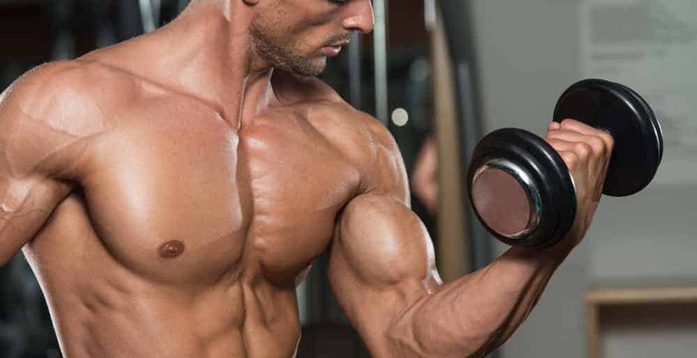 man doing bicep curl with dumbell